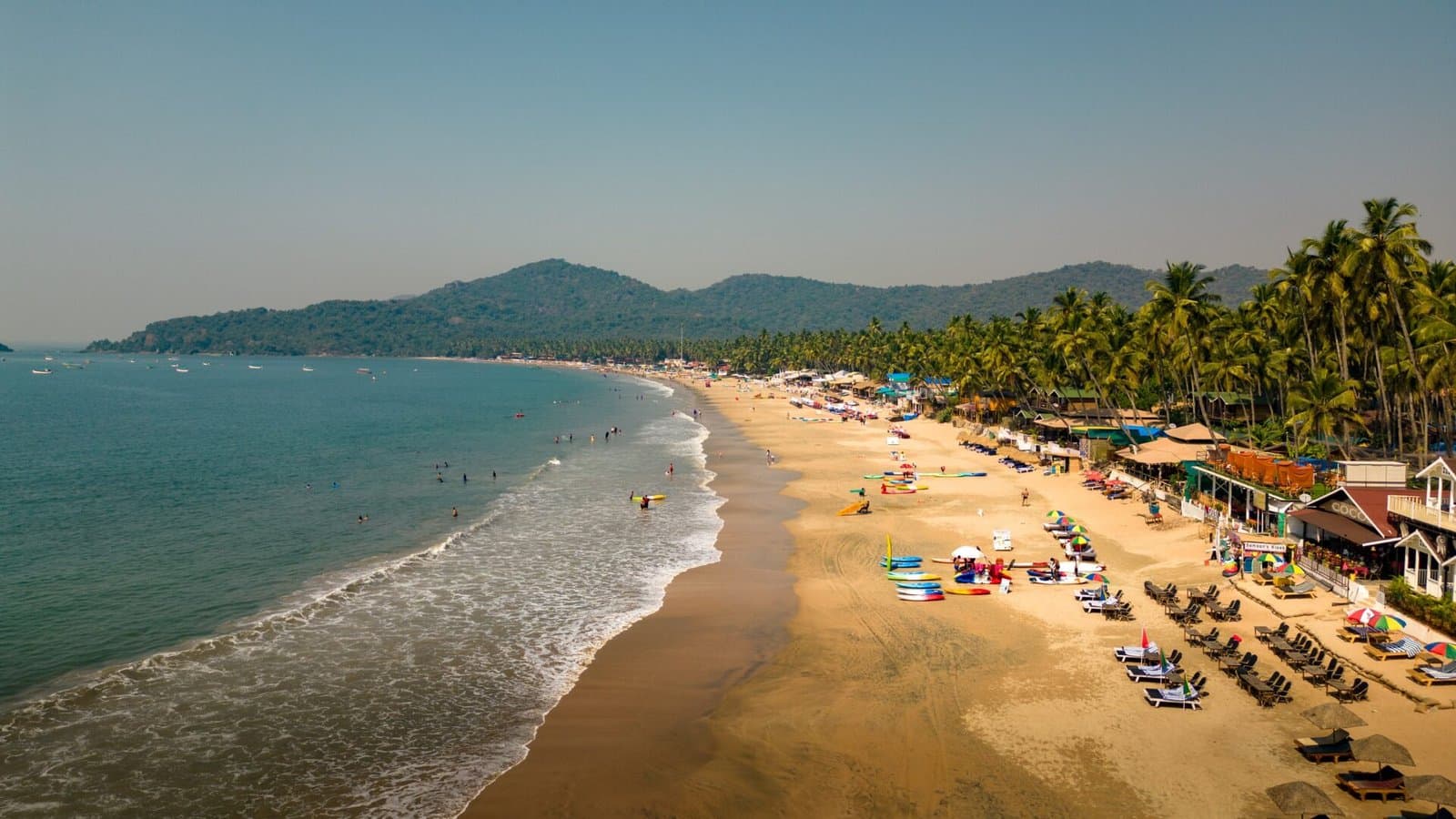 Palolem Beach from above — a crescent of sand, palms and calm sea in South Goa