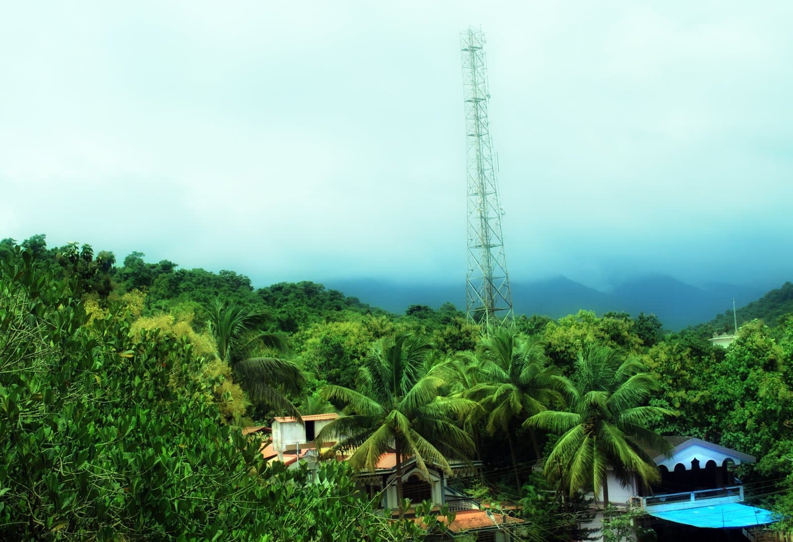 Mist over the green hills of Canacona above the coast